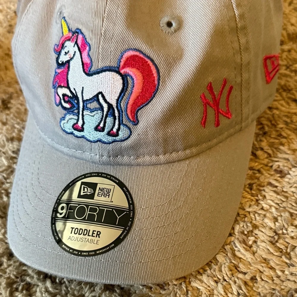 New Era Beige Cap with Unicorn Embroidery purchased at Yankee Stadium